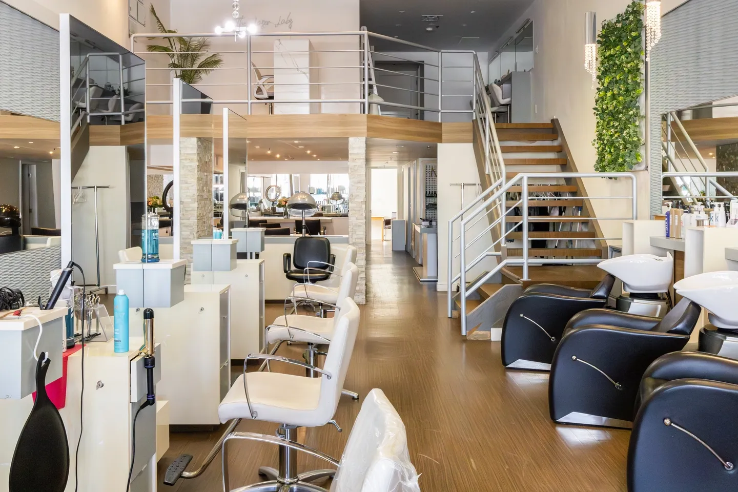 Hair Haven Extension Academy A room with many chairs and tables in it
