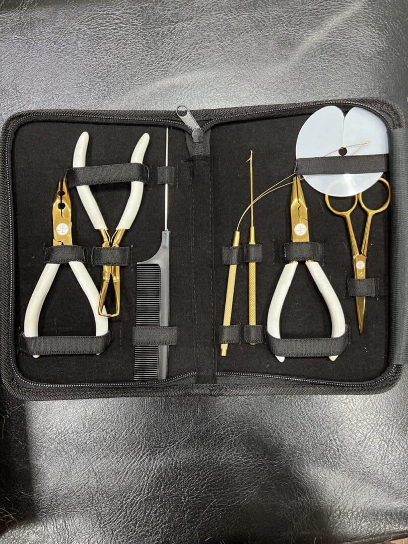 IMG_2012 A set of scissors and other tools in a case.